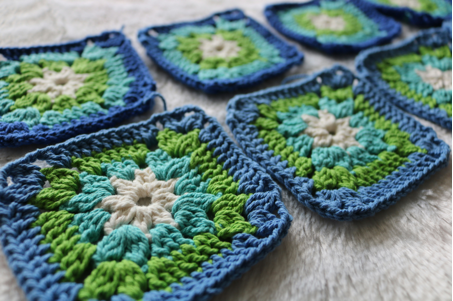 A group of crocheted squares

AI-generated content may be incorrect.